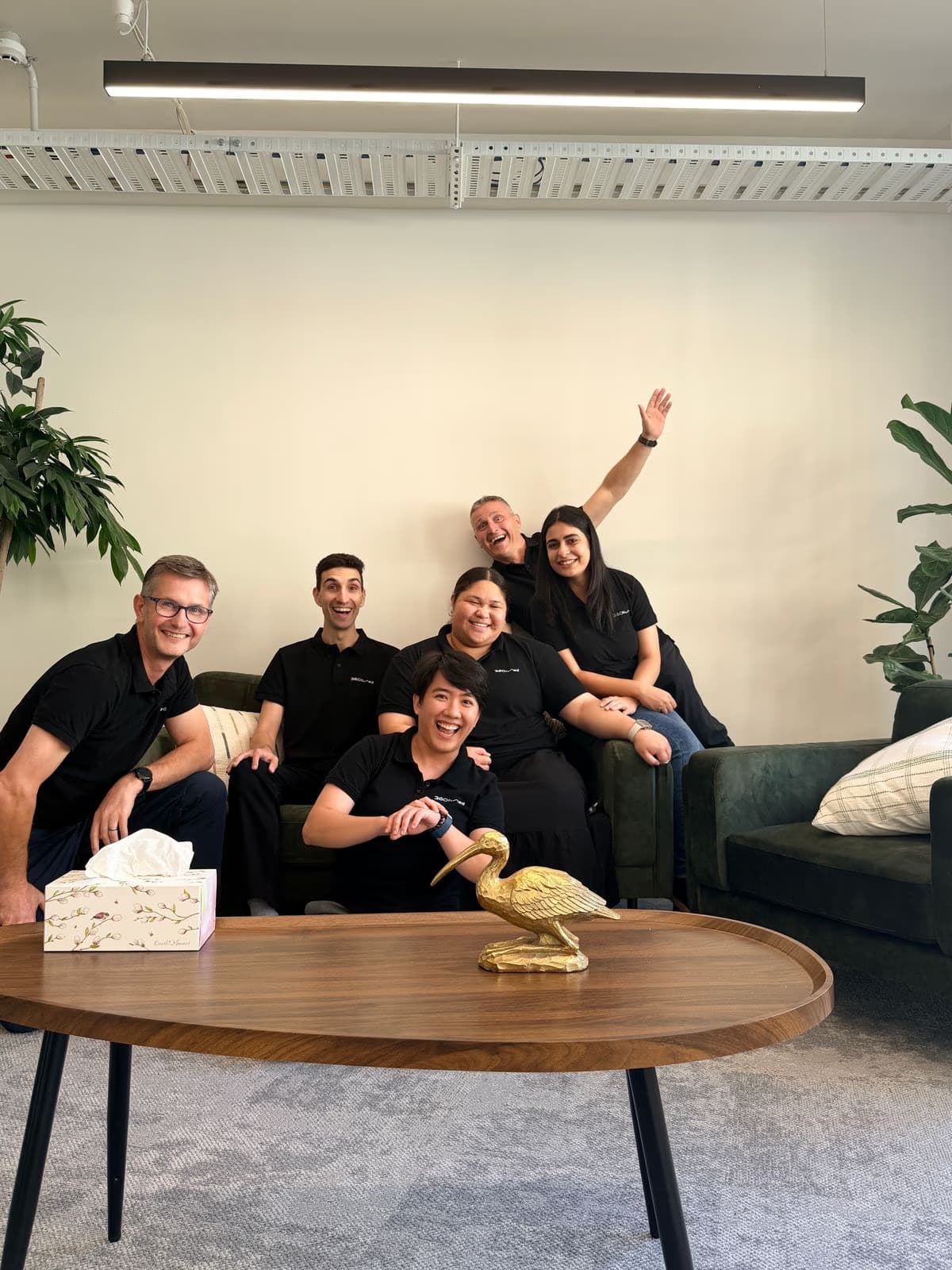 The team celebrating together in the office